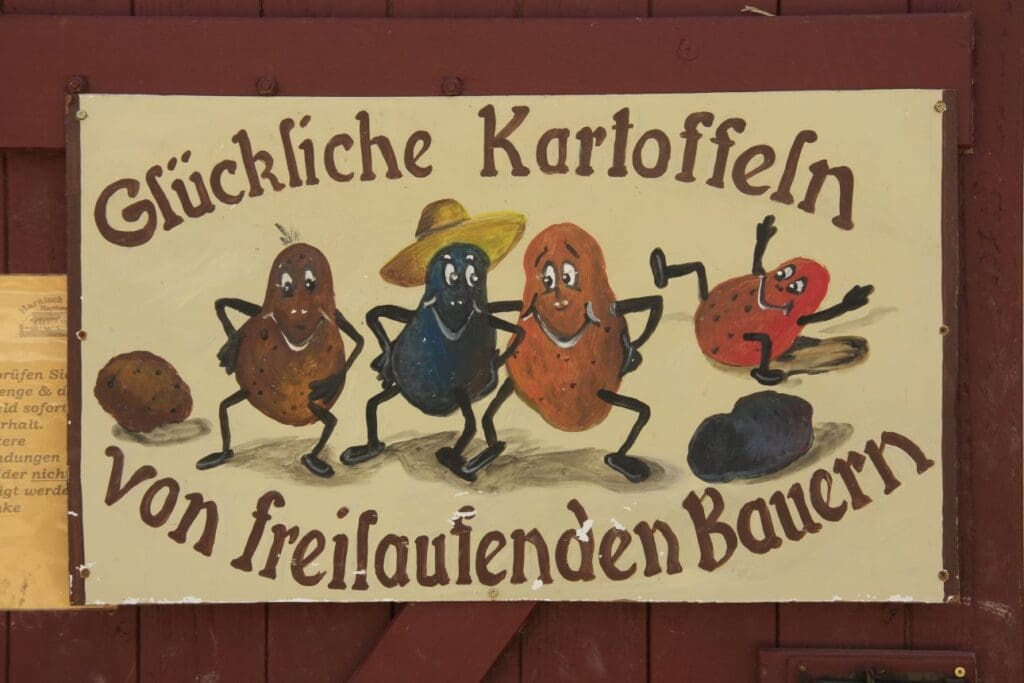 Kartoffeln mit Beinen und Slogan